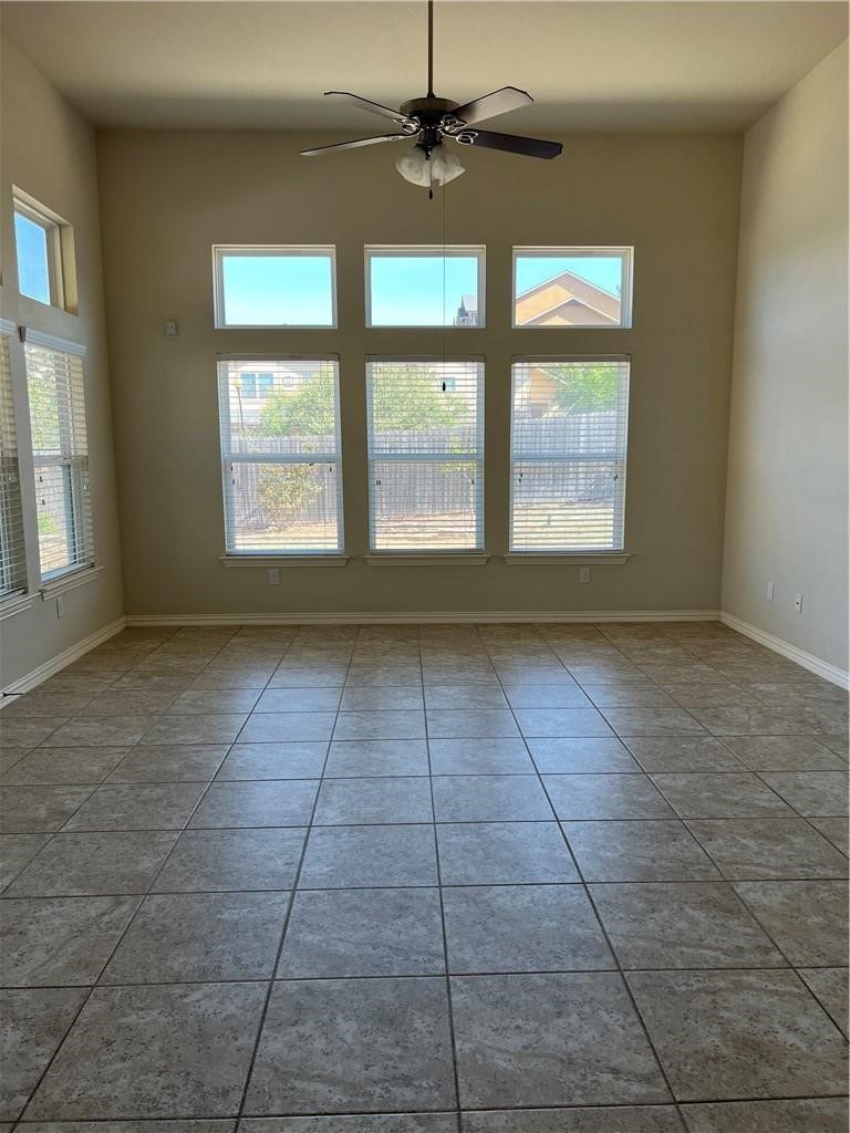 3645 Rams Horn Way Round Rock, TX 78665 - Photo 3 of 16 Spare room with ceiling fan and light tile patterned flooring