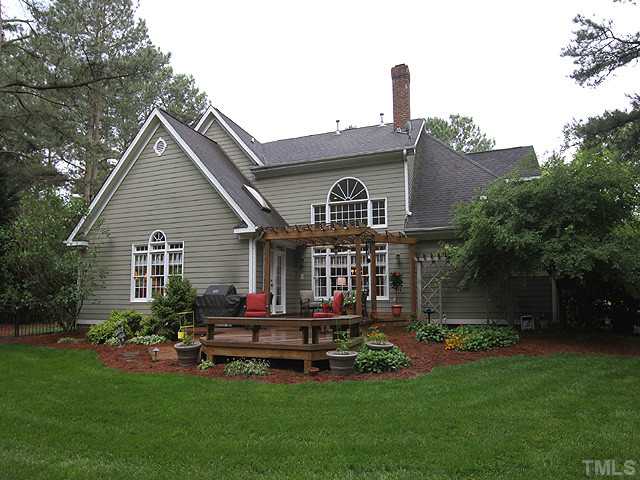 4636 Hidden Harbor Lane Raleigh, NC 27615 - Photo 12 of 16 View of home from the back yard. Note the great Deck and Trellis