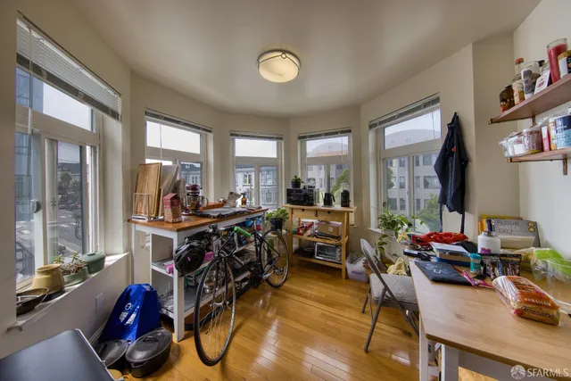 a living room with furniture potted plant and a window