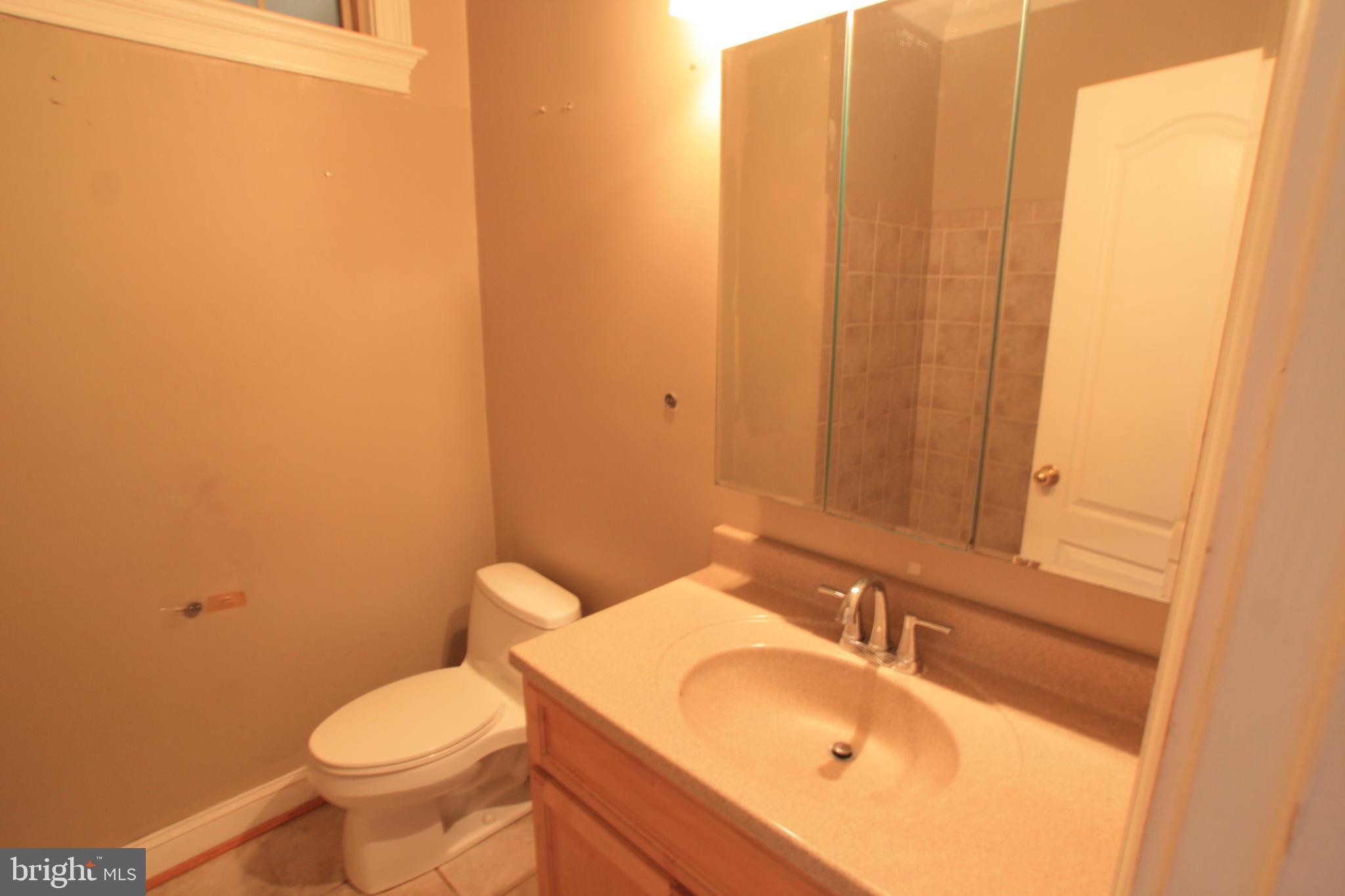 1119 45th Street Northeast Washington, DC 20019 - Photo 13 of 24 Bright and functional bathroom space.
