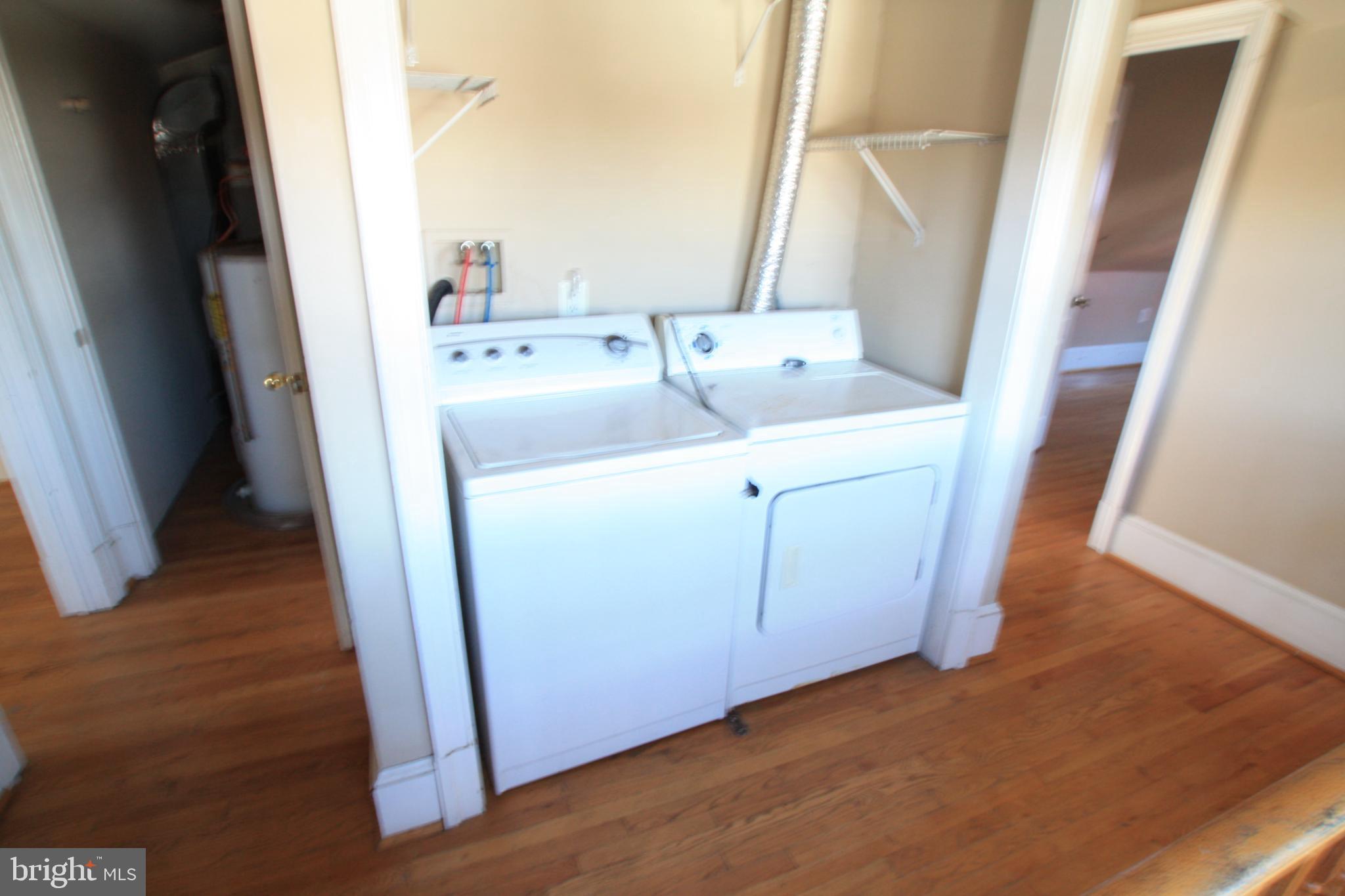 1119 45th Street Northeast Washington, DC 20019 - Photo 17 of 24 Bright upper level laundry area with ample space.