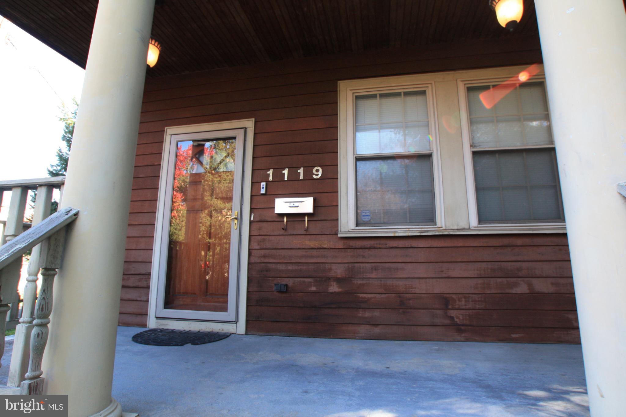1119 45th Street Northeast Washington, DC 20019 - Photo 3 of 24 Charming entrance with rustic wooden accents.