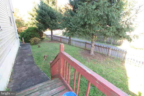 a view of a deck with a backyard