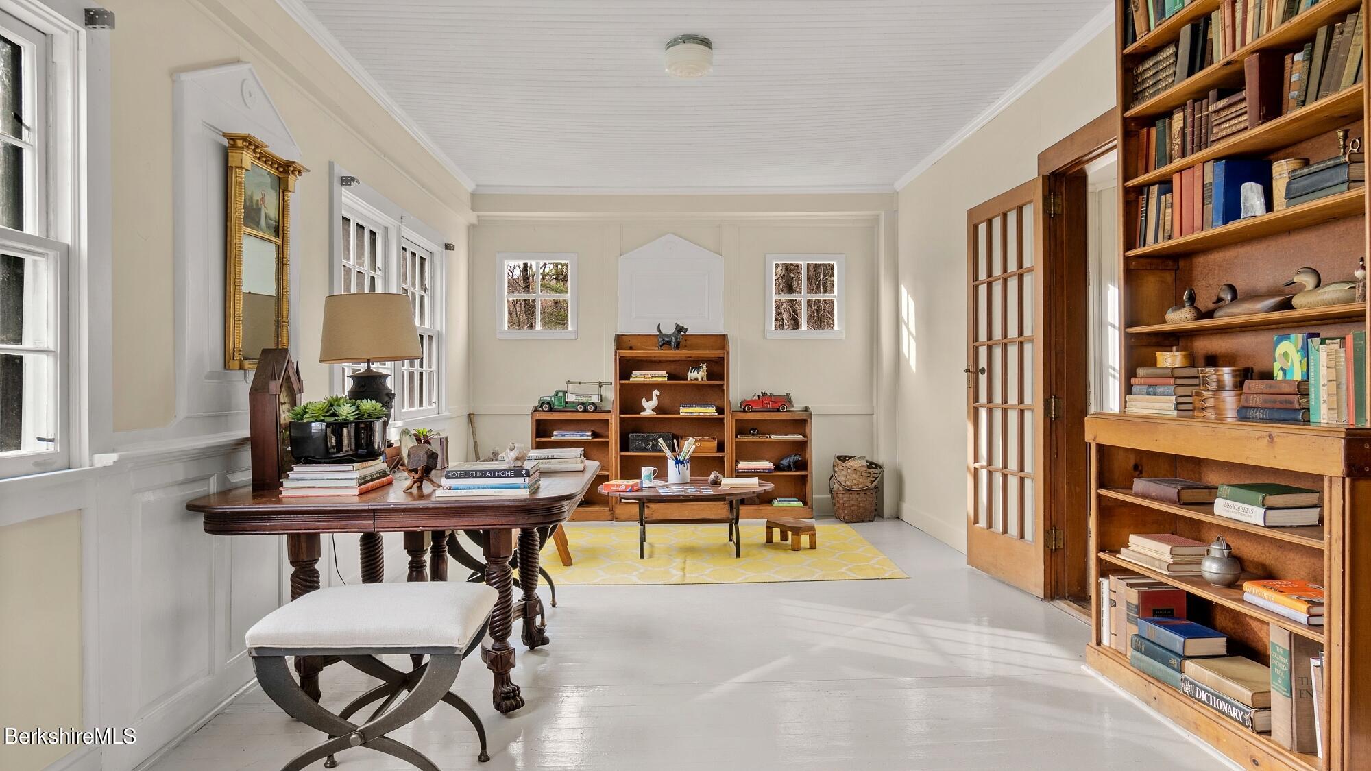 9 Brace Road Tyringham, MA 01264 - Photo 16 of 27 a reading room with furniture and a book shelf