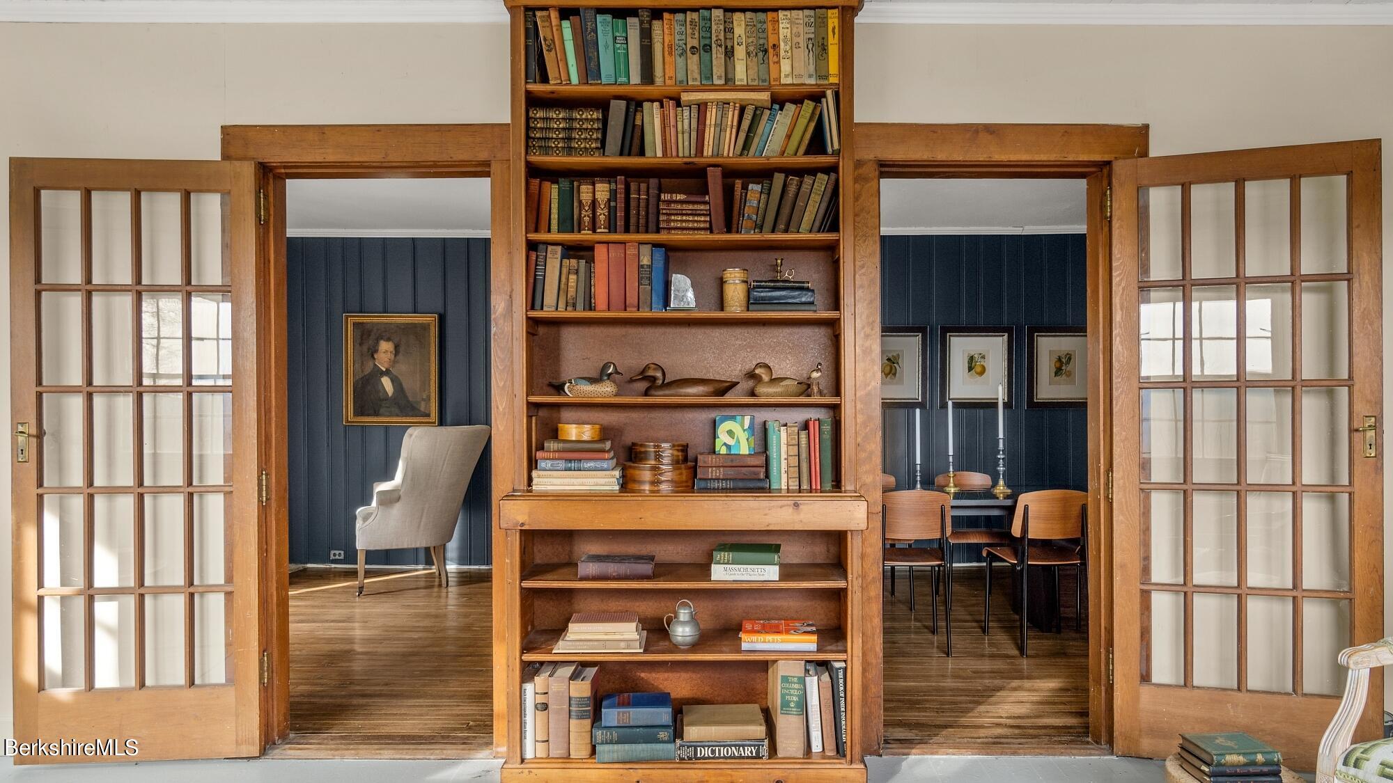 9 Brace Road Tyringham, MA 01264 - Photo 17 of 27 a living room with furniture a rug and a book shelf