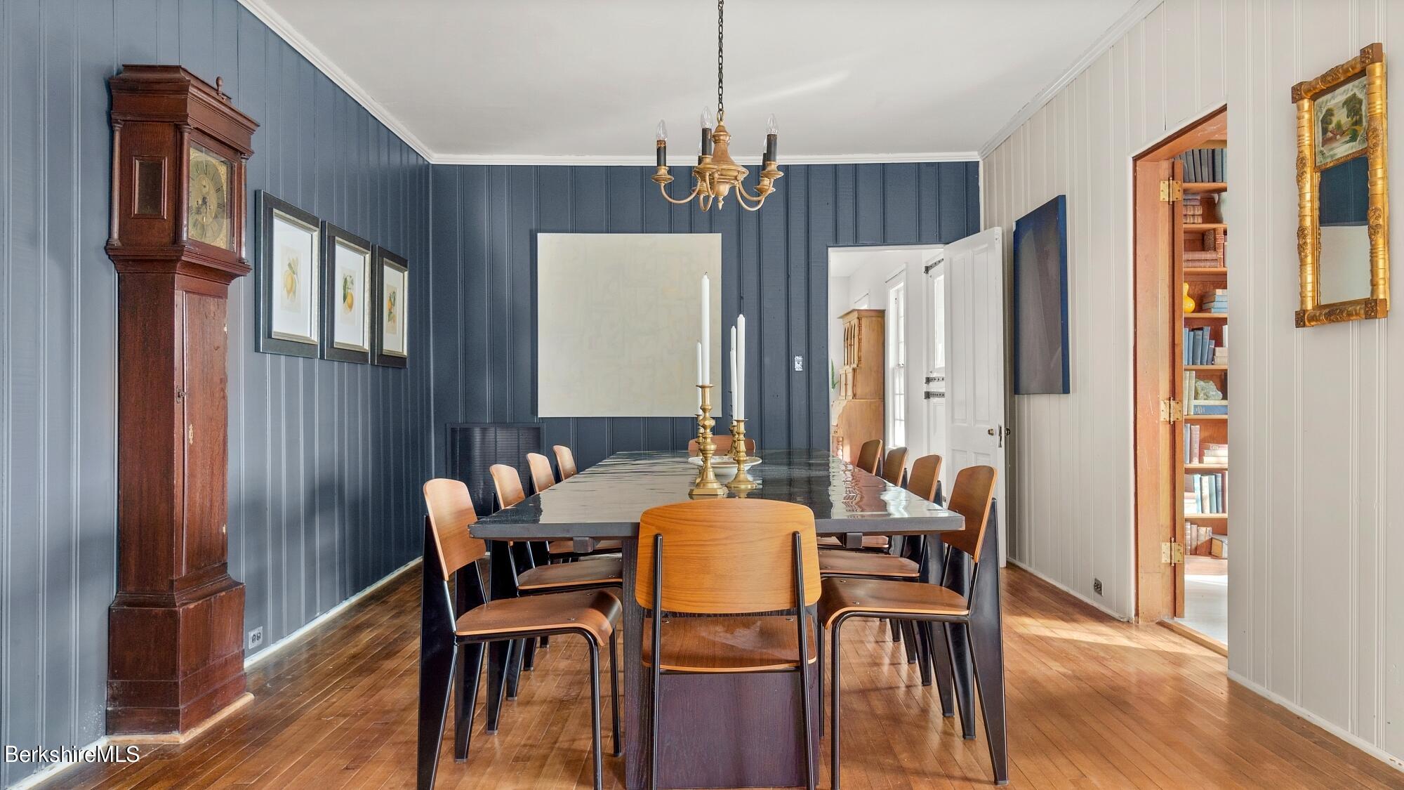9 Brace Road Tyringham, MA 01264 - Photo 18 of 27 a dining room with furniture a chandelier and wooden floor