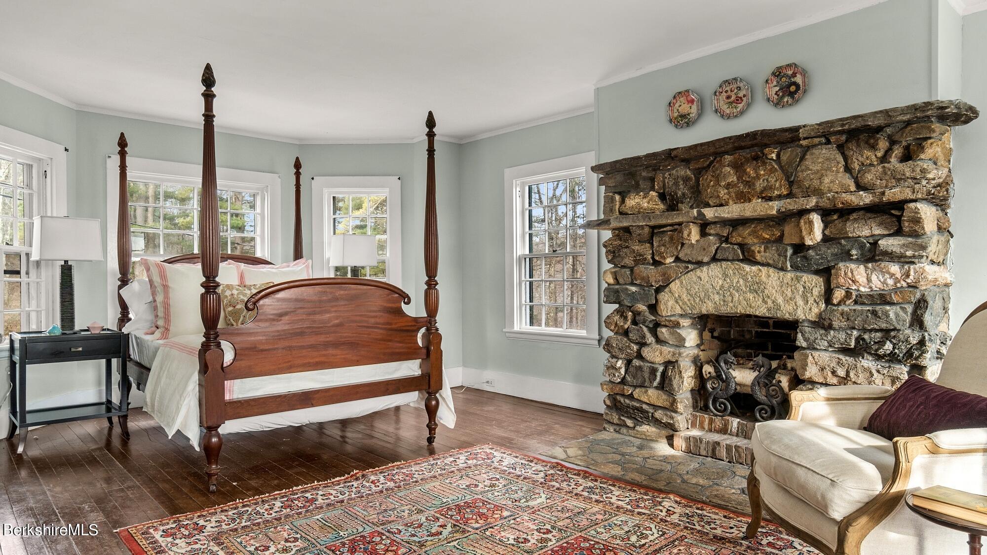 9 Brace Road Tyringham, MA 01264 - Photo 19 of 27 a bed room with a bed and a fireplace