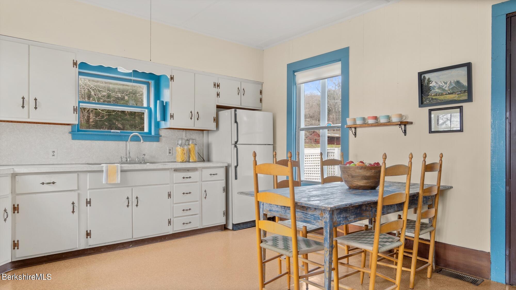 9 Brace Road Tyringham, MA 01264 - Photo 24 of 27 a kitchen that has a cabinets and a table in it