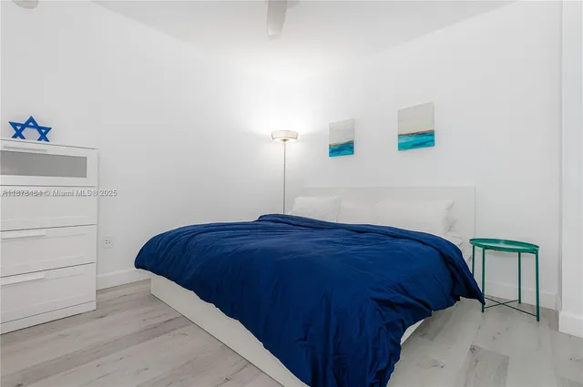 a bedroom with a bed and a cabinets