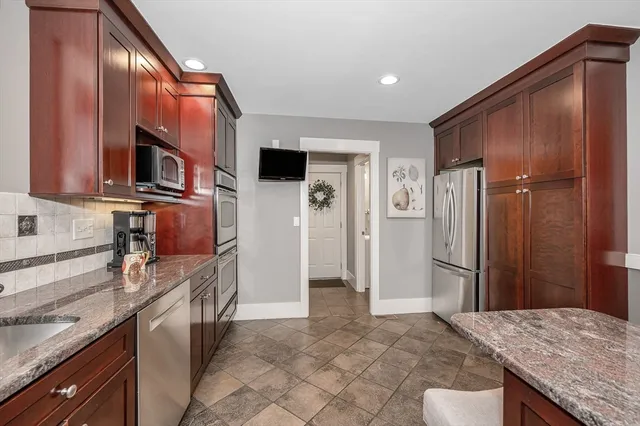 a bathroom with a toilet a sink and shower