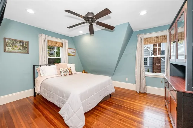 a bathroom with a granite countertop sink a toilet and a bathtub