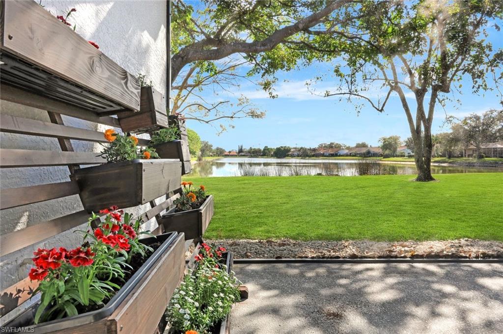 6900 Lone Oak Boulevard Naples, FL 34109 - Photo 15 of 23 a front view of a house with garden