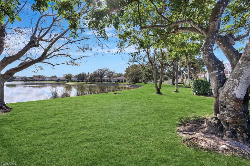 6900 Lone Oak Boulevard Naples, FL 34109 - Photo 17 of 23 a view of outdoor space with green field and trees
