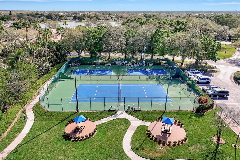 6900 Lone Oak Boulevard Naples, FL 34109 - Photo 22 of 23 a garden view with a seating space
