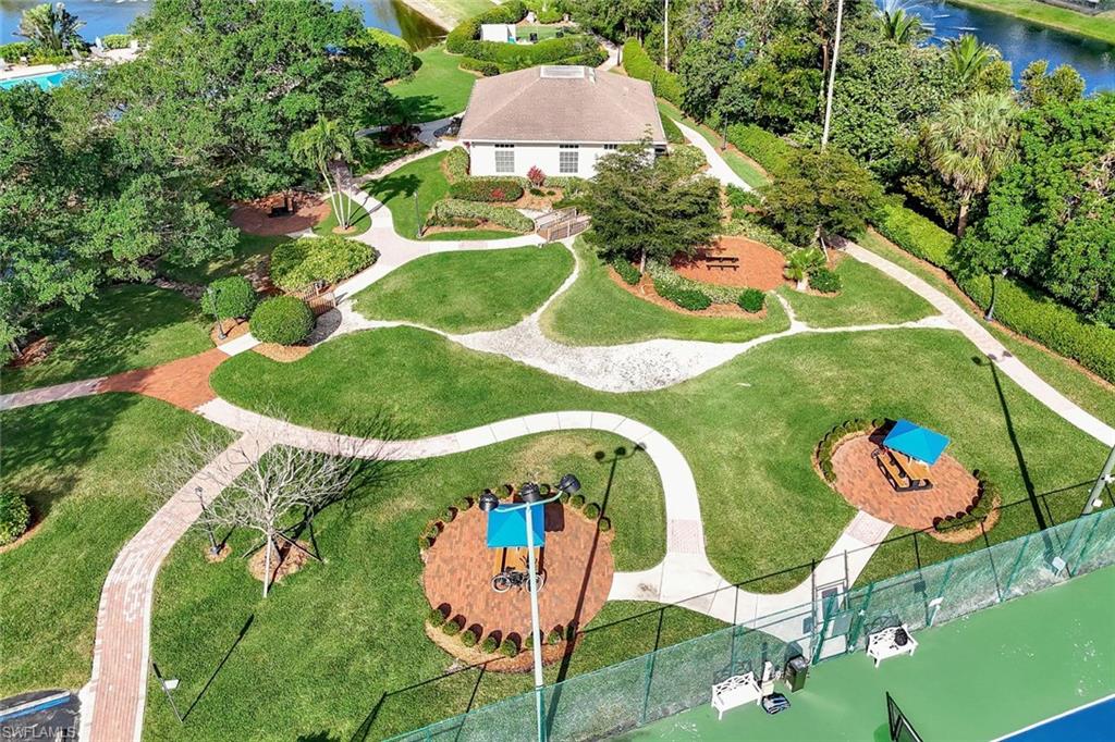6900 Lone Oak Boulevard Naples, FL 34109 - Photo 23 of 23 an aerial view of a play ground and swimming pool