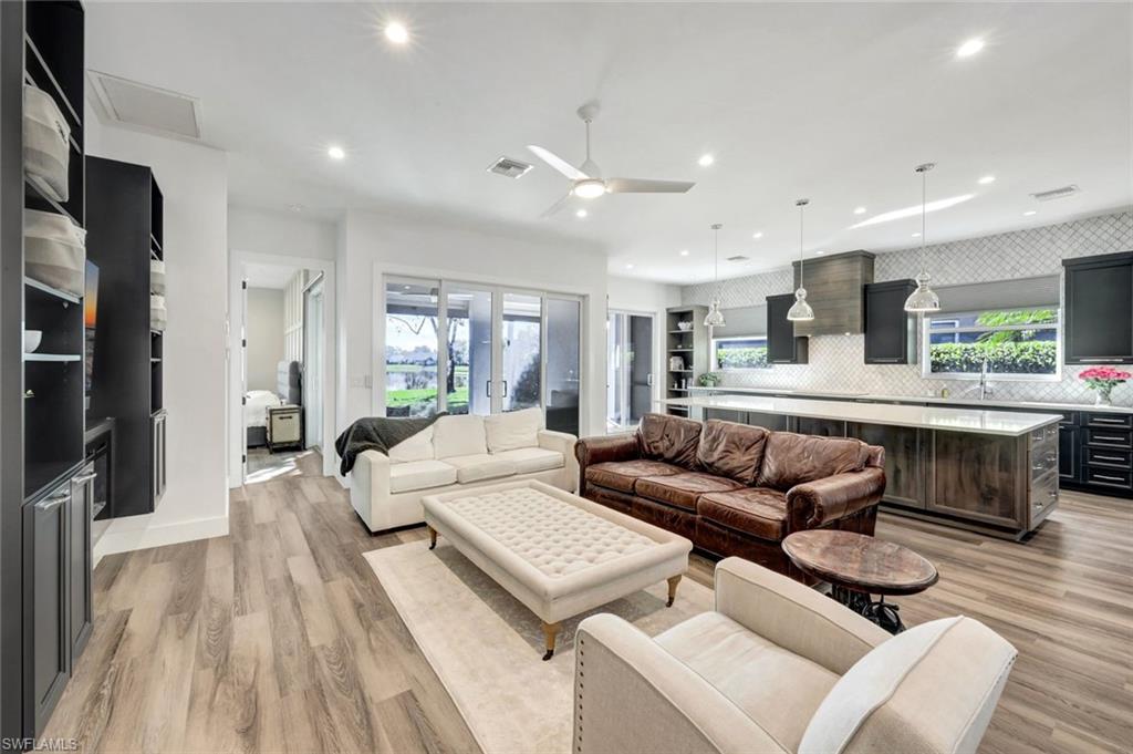 6900 Lone Oak Boulevard Naples, FL 34109 - Photo 3 of 23 a living room with furniture and a large window