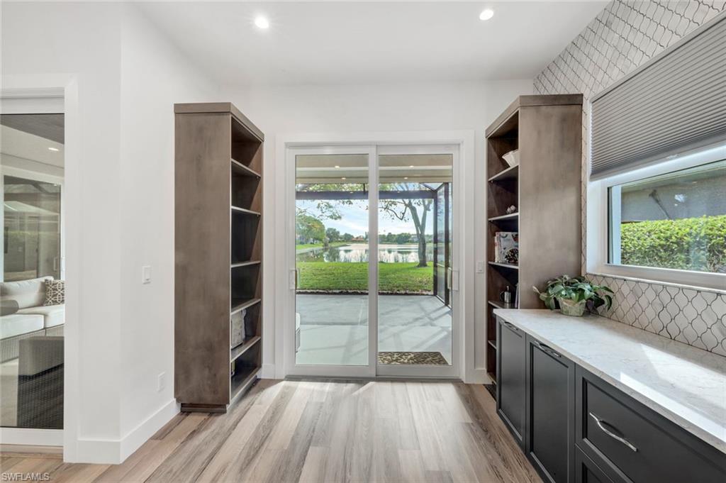 6900 Lone Oak Boulevard Naples, FL 34109 - Photo 7 of 23 a bathroom with a tub and shower