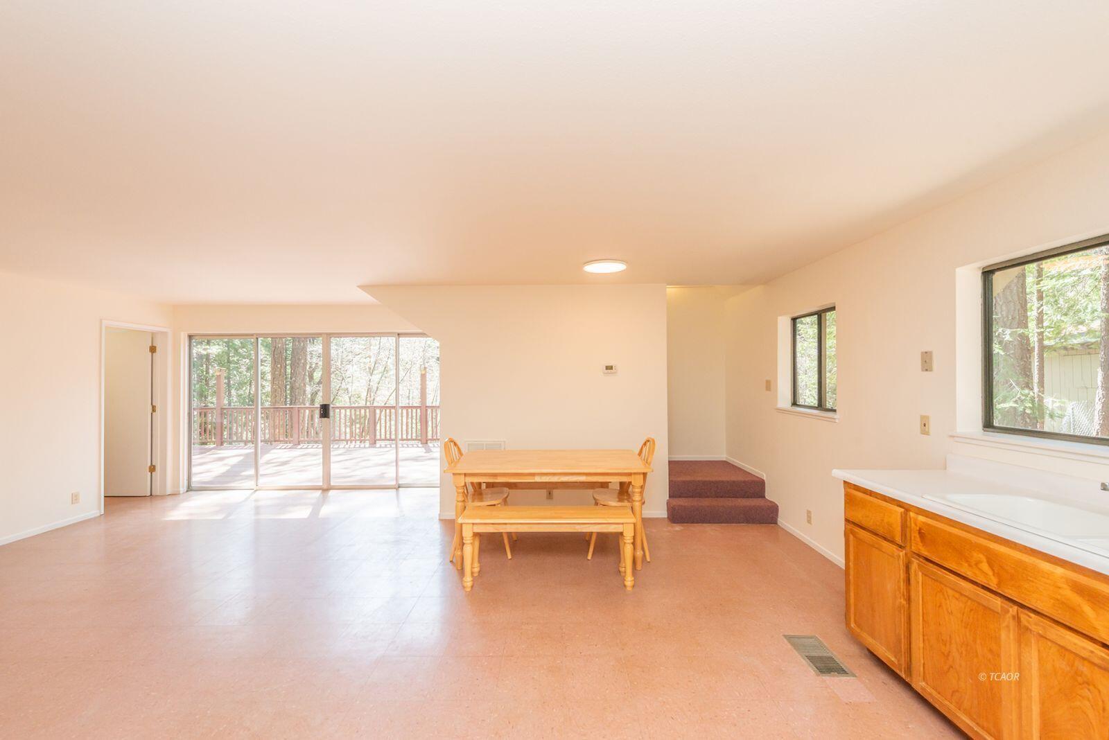 121-141 Mountain Aire Road Trinity Center, CA 96091 - Photo 14 of 51 a living room with furniture and a large window