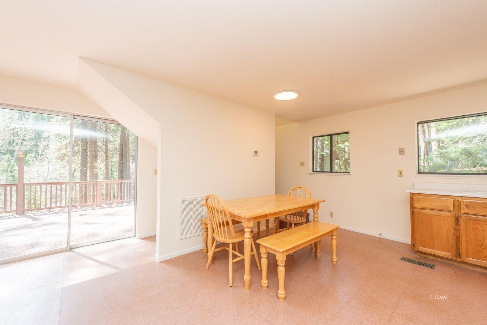 121-141 Mountain Aire Road Trinity Center, CA 96091 - Photo 15 of 51 a dining room with furniture and a window