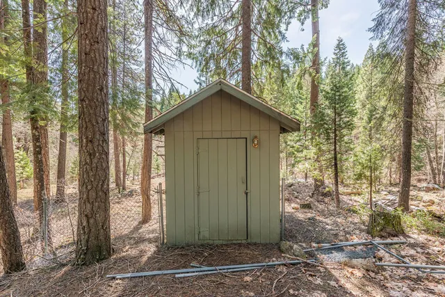 a house with trees in the background