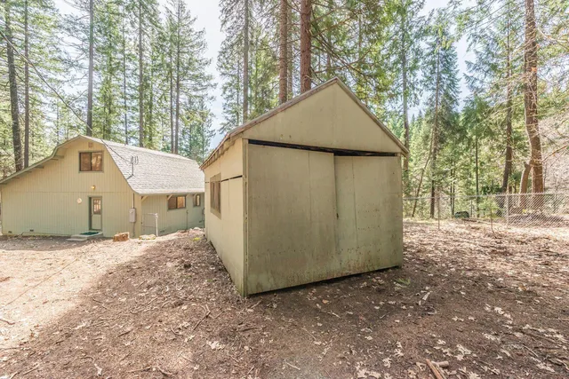 a room with furniture and floor to ceiling windows