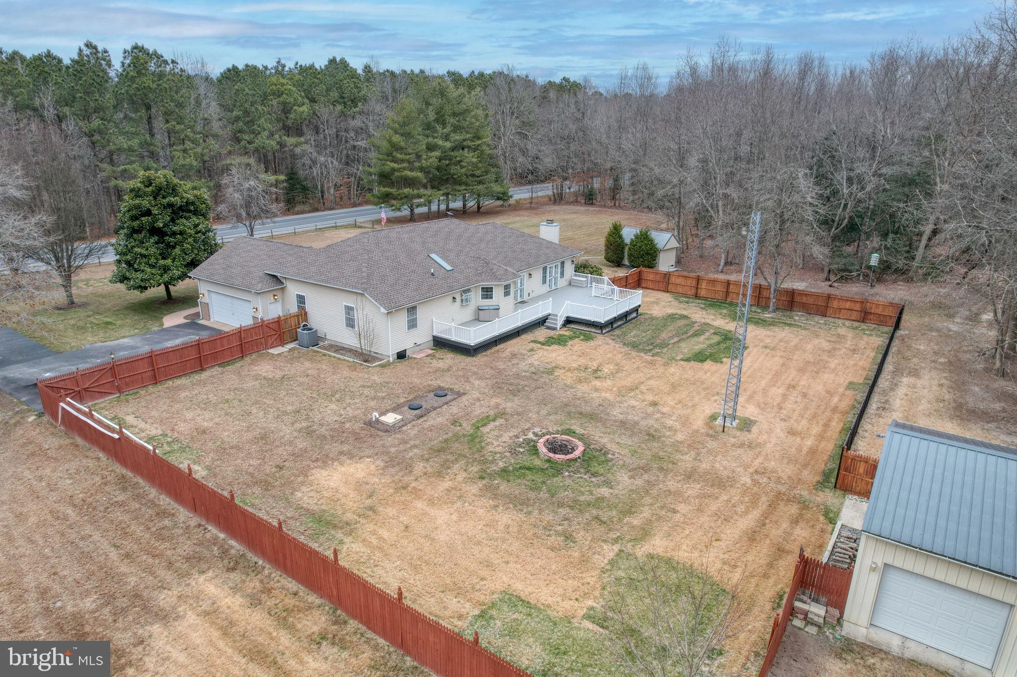 10821 Shawnee Road Harrington, DE 19952 - Photo 13 of 53 a view of a backyard with sitting area