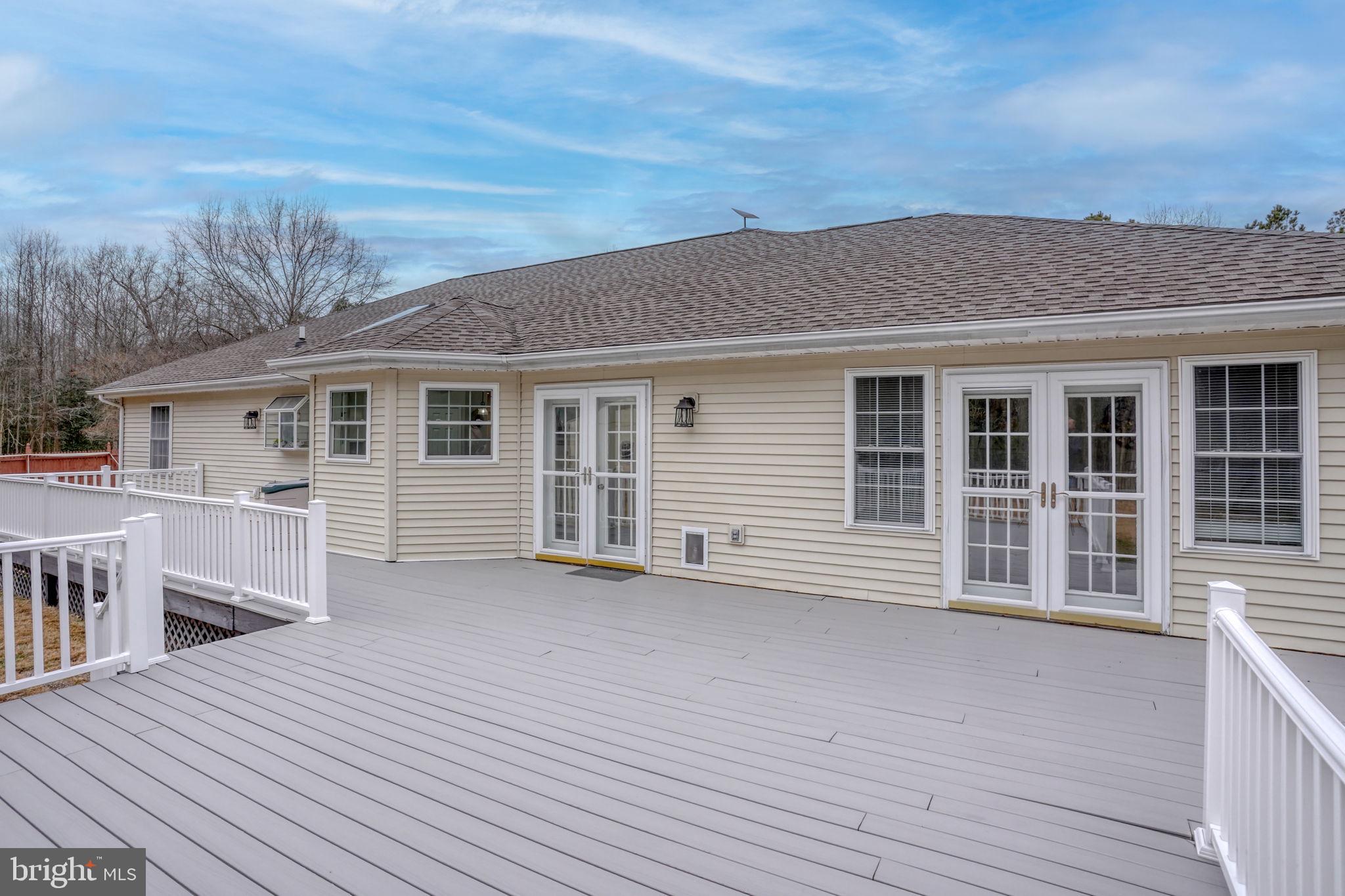 10821 Shawnee Road Harrington, DE 19952 - Photo 15 of 53 a view of a house with a wooden deck