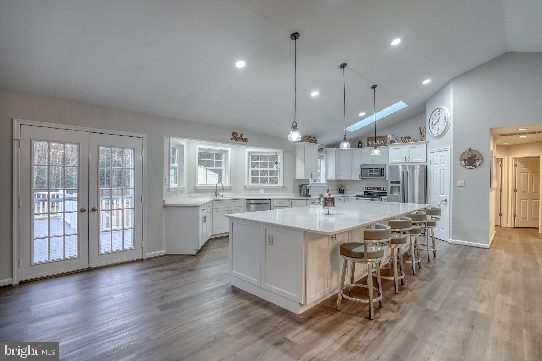 10821 Shawnee Road Harrington, DE 19952 - Photo 24 of 53 a large kitchen with a table and chairs