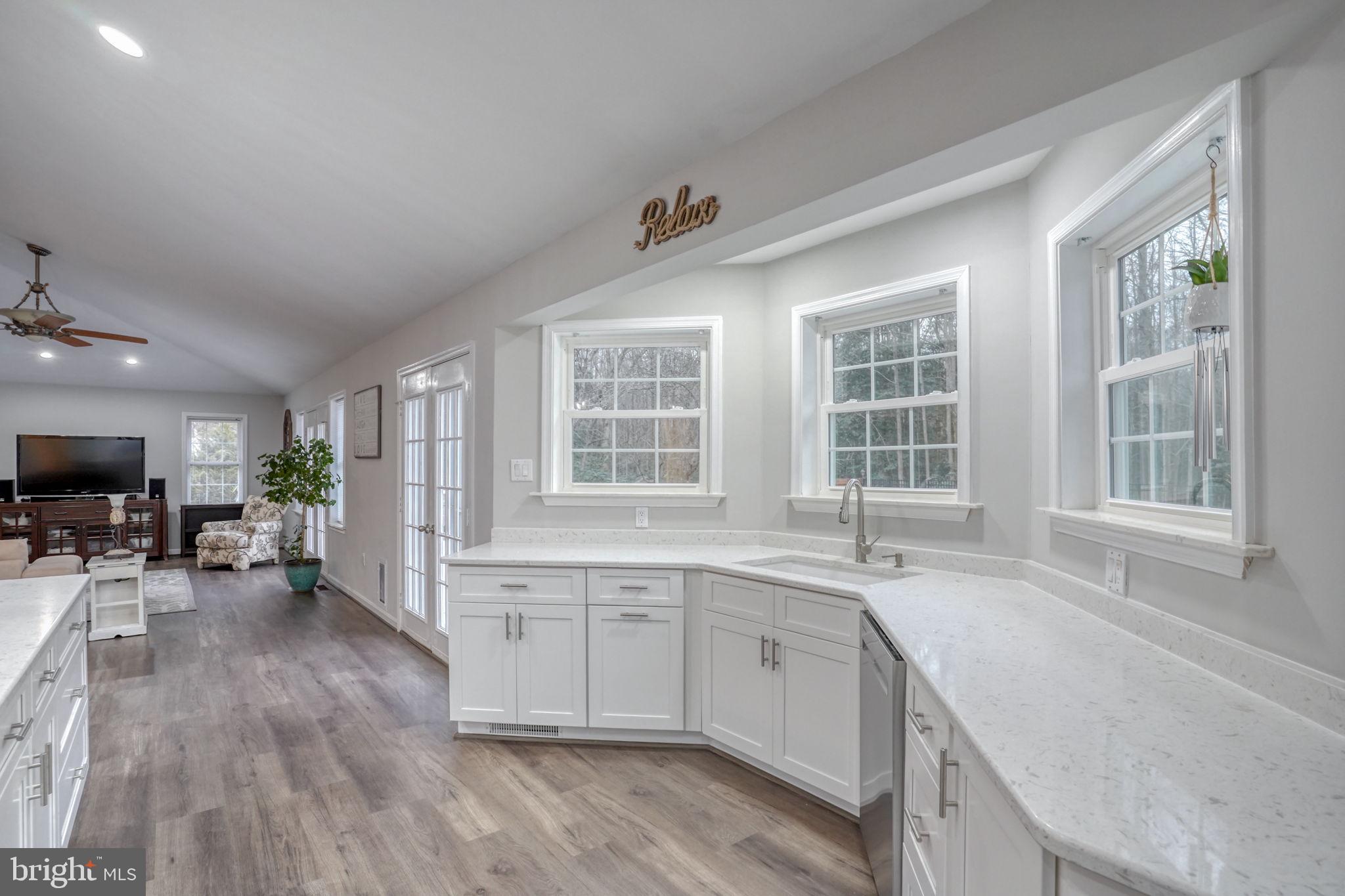 10821 Shawnee Road Harrington, DE 19952 - Photo 25 of 53 a kitchen with a sink stove and cabinets