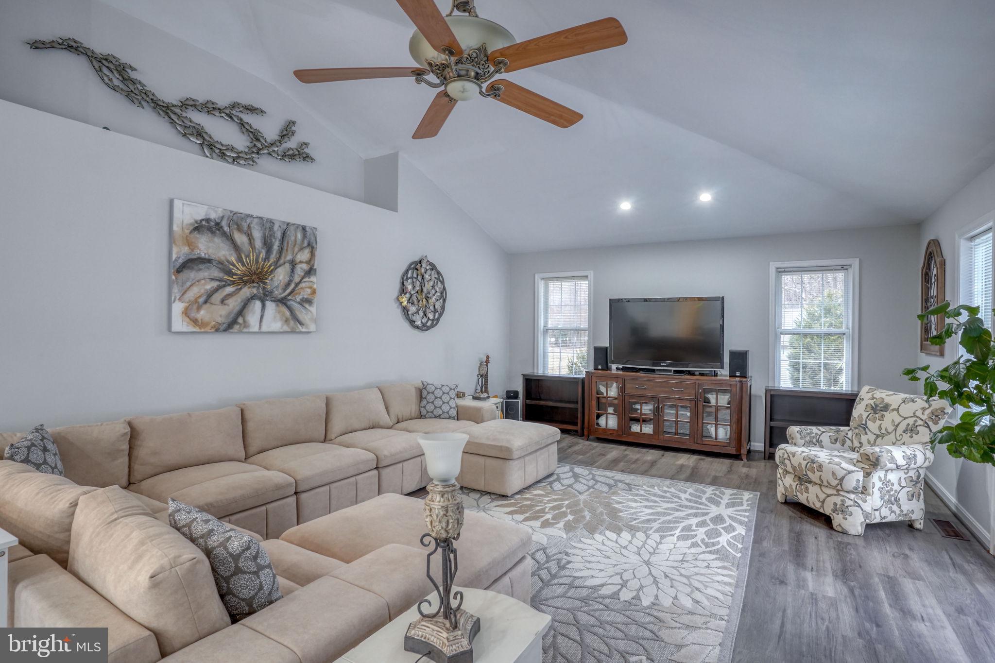 10821 Shawnee Road Harrington, DE 19952 - Photo 27 of 53 a living room with furniture and a flat screen tv