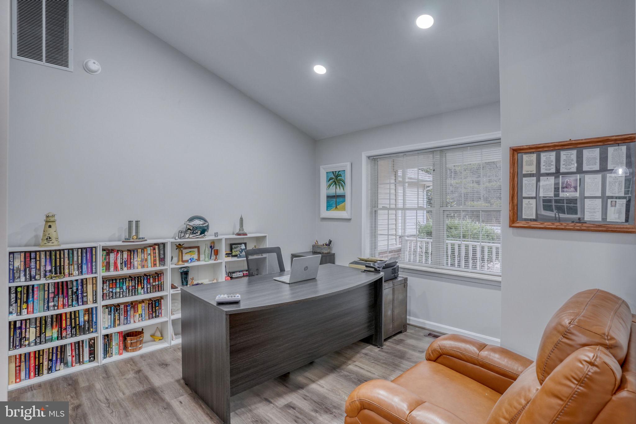 10821 Shawnee Road Harrington, DE 19952 - Photo 30 of 53 a living room with furniture and a book shelf