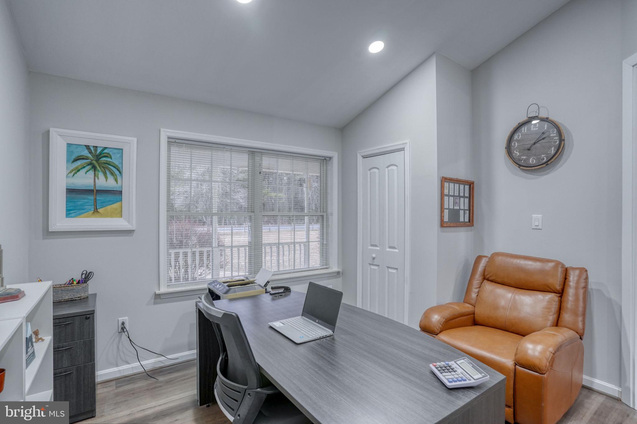 10821 Shawnee Road Harrington, DE 19952 - Photo 31 of 53 a workspace with furniture and a large window