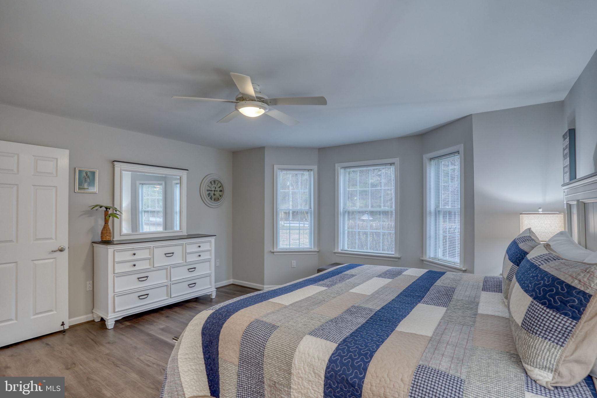10821 Shawnee Road Harrington, DE 19952 - Photo 33 of 53 a bedroom with a bed and a dresser