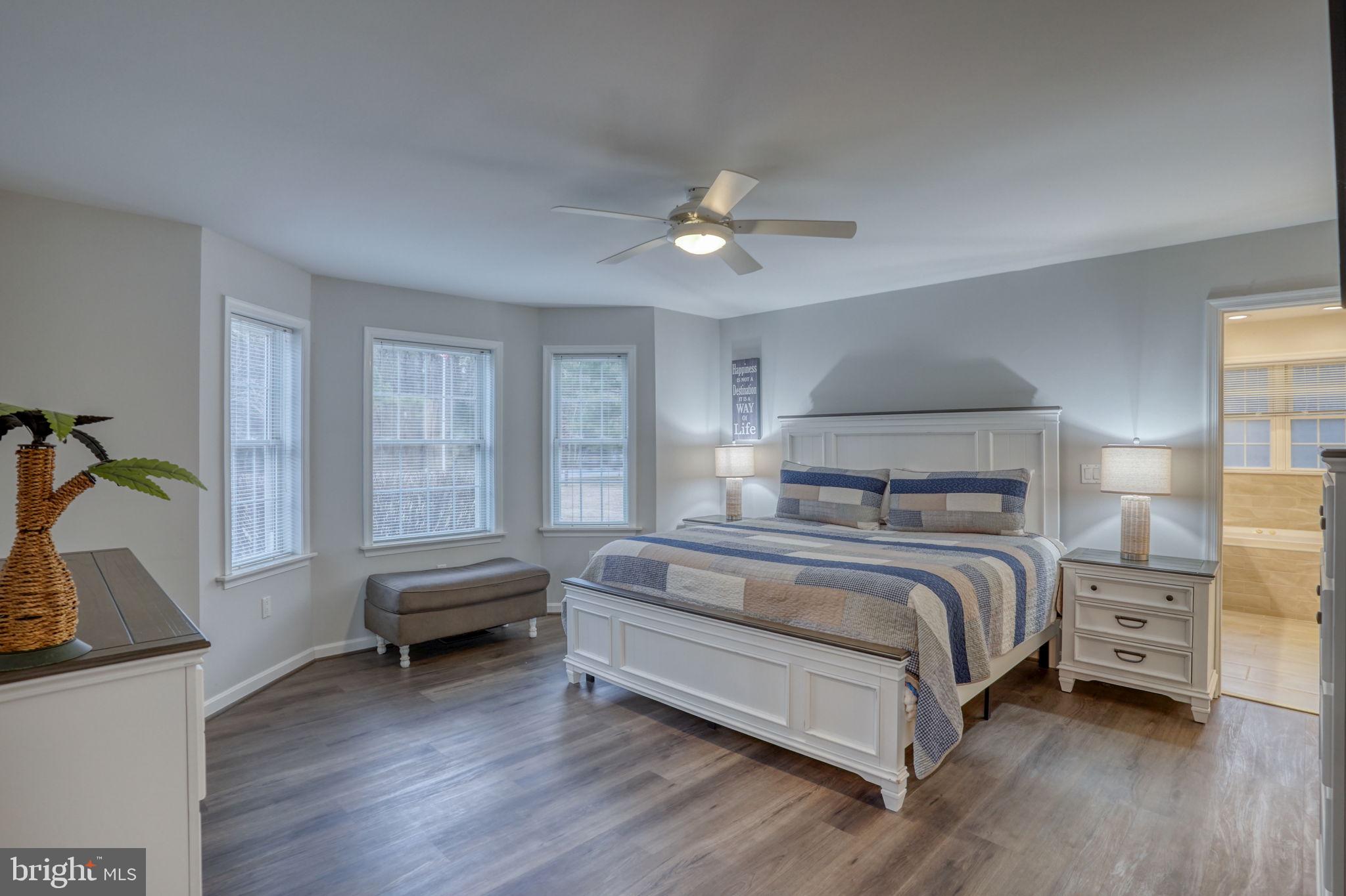 10821 Shawnee Road Harrington, DE 19952 - Photo 34 of 53 a bed room with a bed and a window