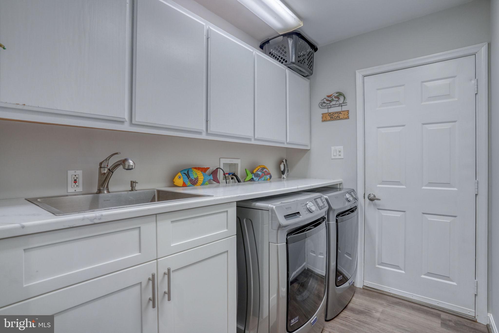 10821 Shawnee Road Harrington, DE 19952 - Photo 45 of 53 a utility room with sink dryer and washer