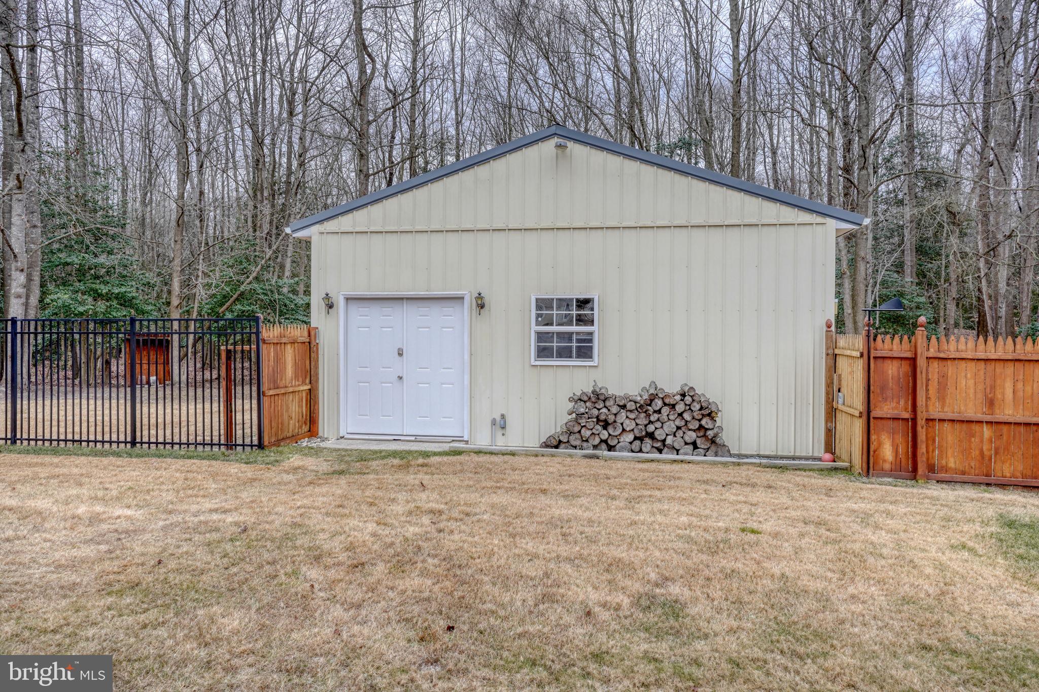 10821 Shawnee Road Harrington, DE 19952 - Photo 46 of 53 a view of a house with a yard