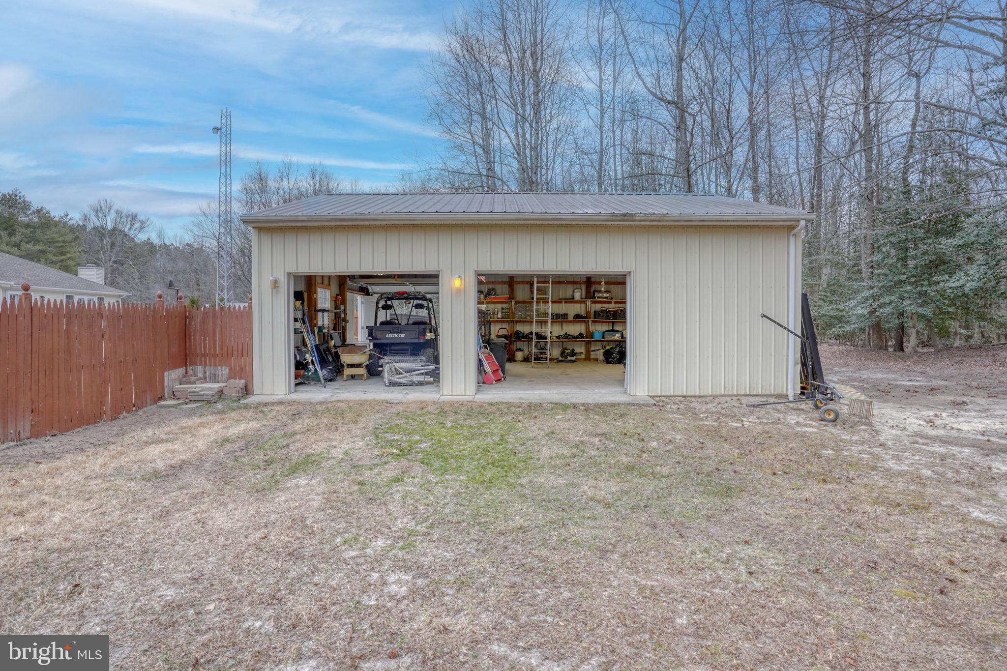 10821 Shawnee Road Harrington, DE 19952 - Photo 49 of 53 a view of an empty room with a fireplace and garage