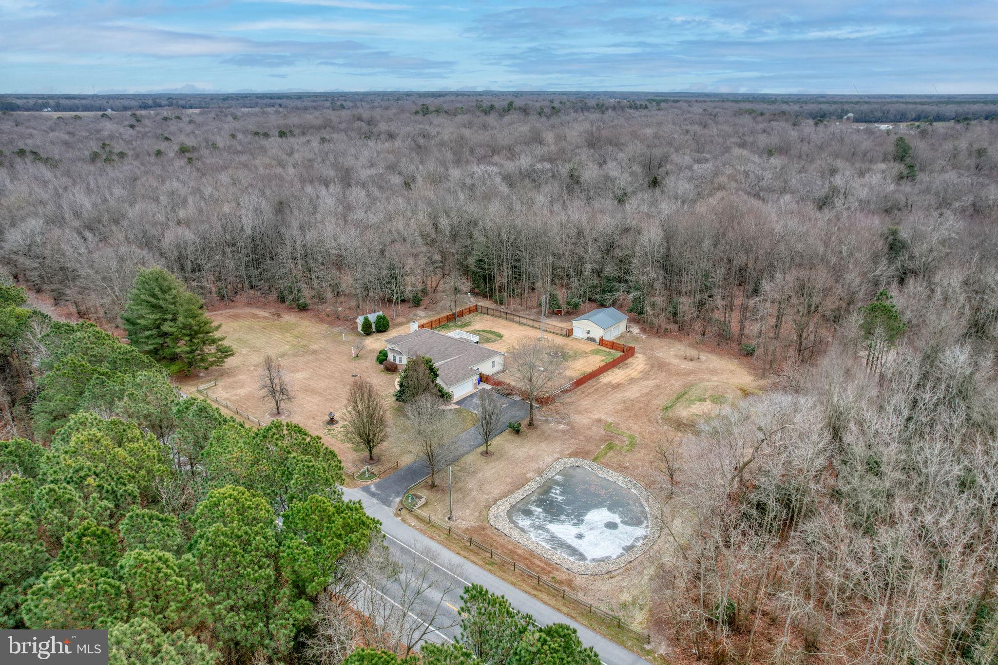 10821 Shawnee Road Harrington, DE 19952 - Photo 51 of 53 an aerial view of a house with a yard