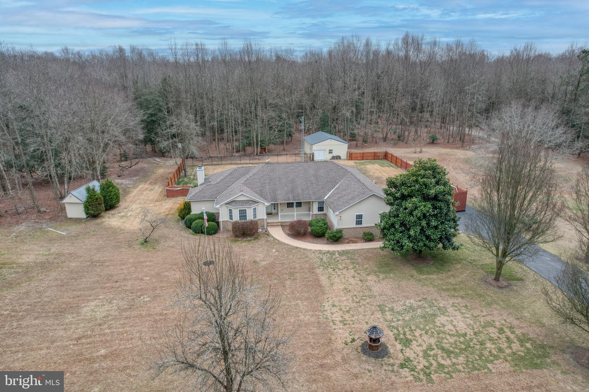 10821 Shawnee Road Harrington, DE 19952 - Photo 6 of 53 an aerial view of a house with yard and mountain view in back