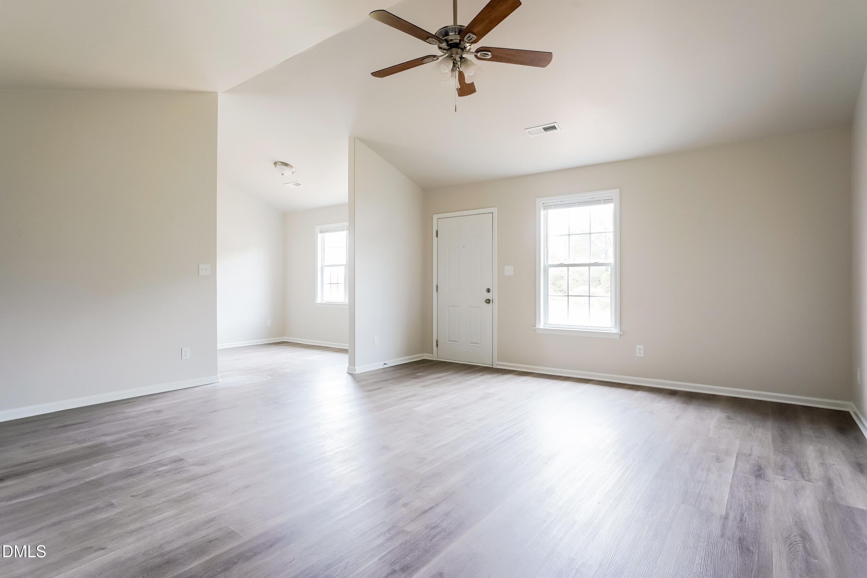 77 Jethro Circle Smithfield, NC 27577 - Photo 3 of 16 wooden floor in an empty room with a window