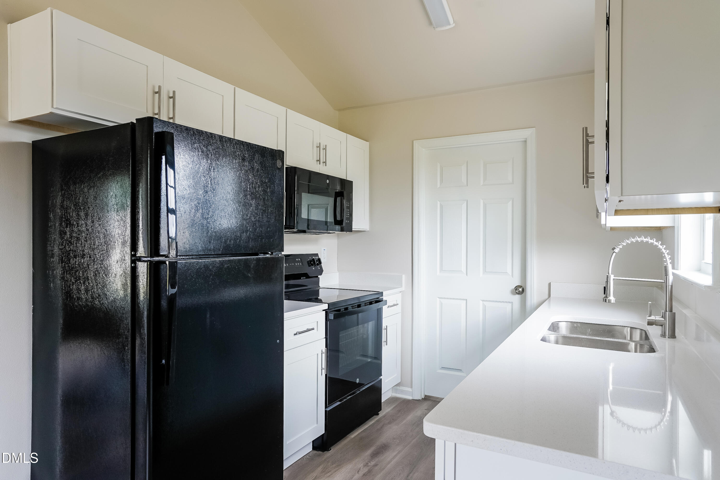 77 Jethro Circle Smithfield, NC 27577 - Photo 6 of 16 a kitchen with a refrigerator sink and stove