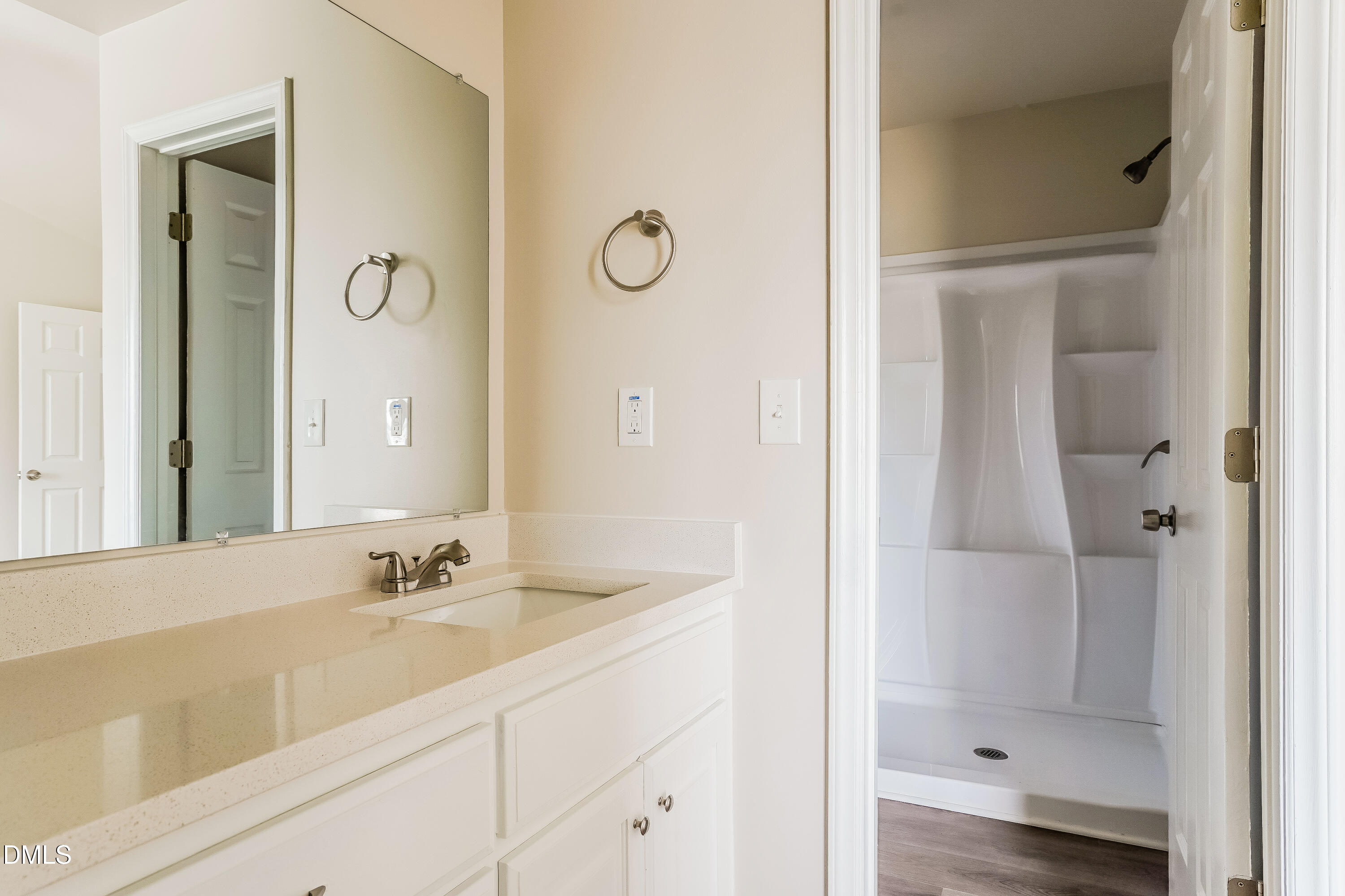 77 Jethro Circle Smithfield, NC 27577 - Photo 10 of 16 a bathroom with a shower sink and mirror