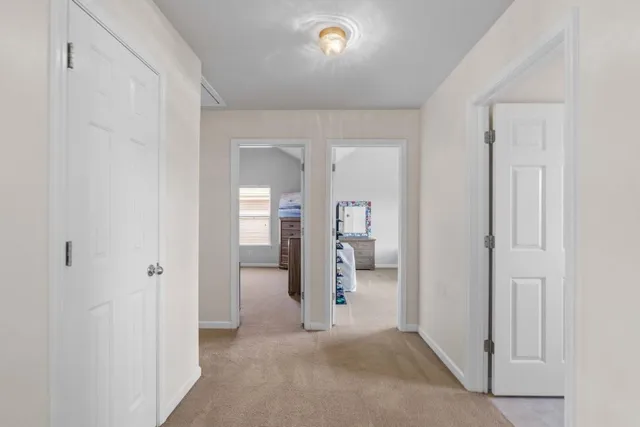 a bedroom with bed and a window