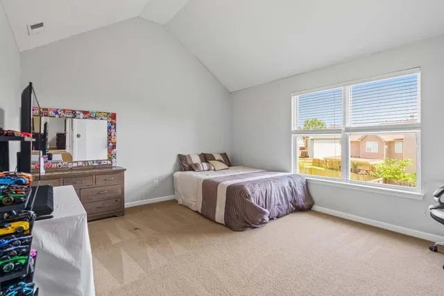 a bedroom with a bed and a closet