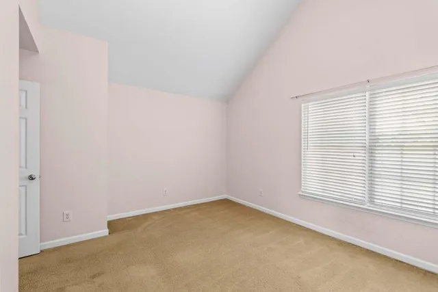 a view of a balcony with furniture