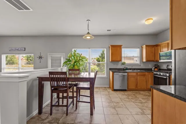 a kitchen with a table and chairs in it
