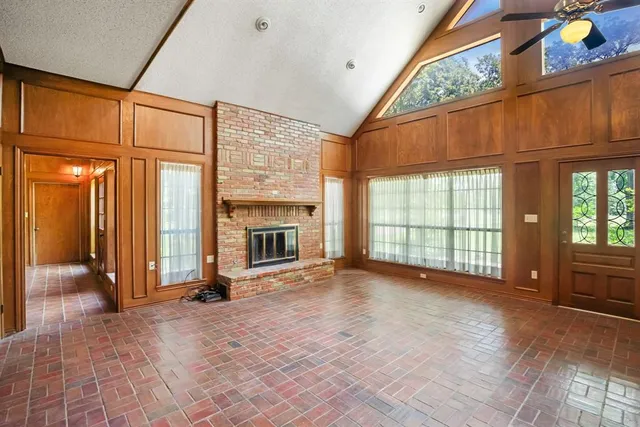 a kitchen with refrigerator a stove and wooden cabinets