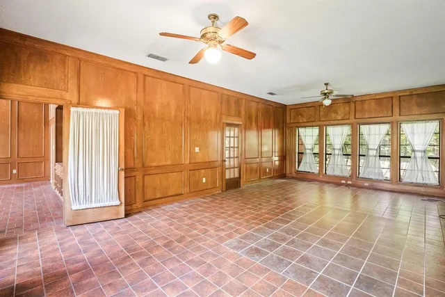 a bath tub sitting in a bathroom next to a window