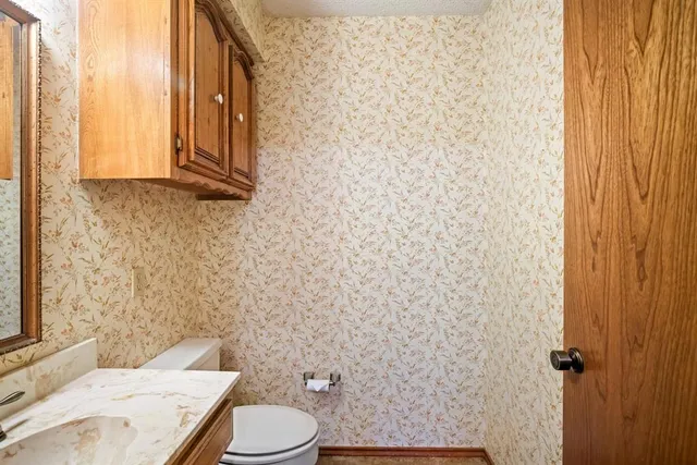 a view of a living room with a fireplace and a floor to ceiling window