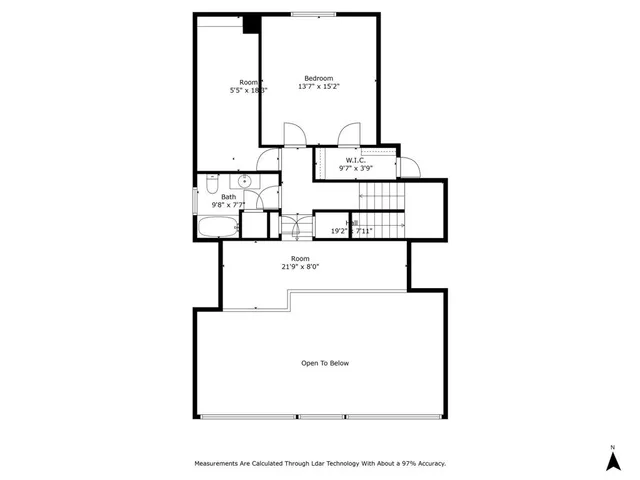 a white house with a big yard and large trees